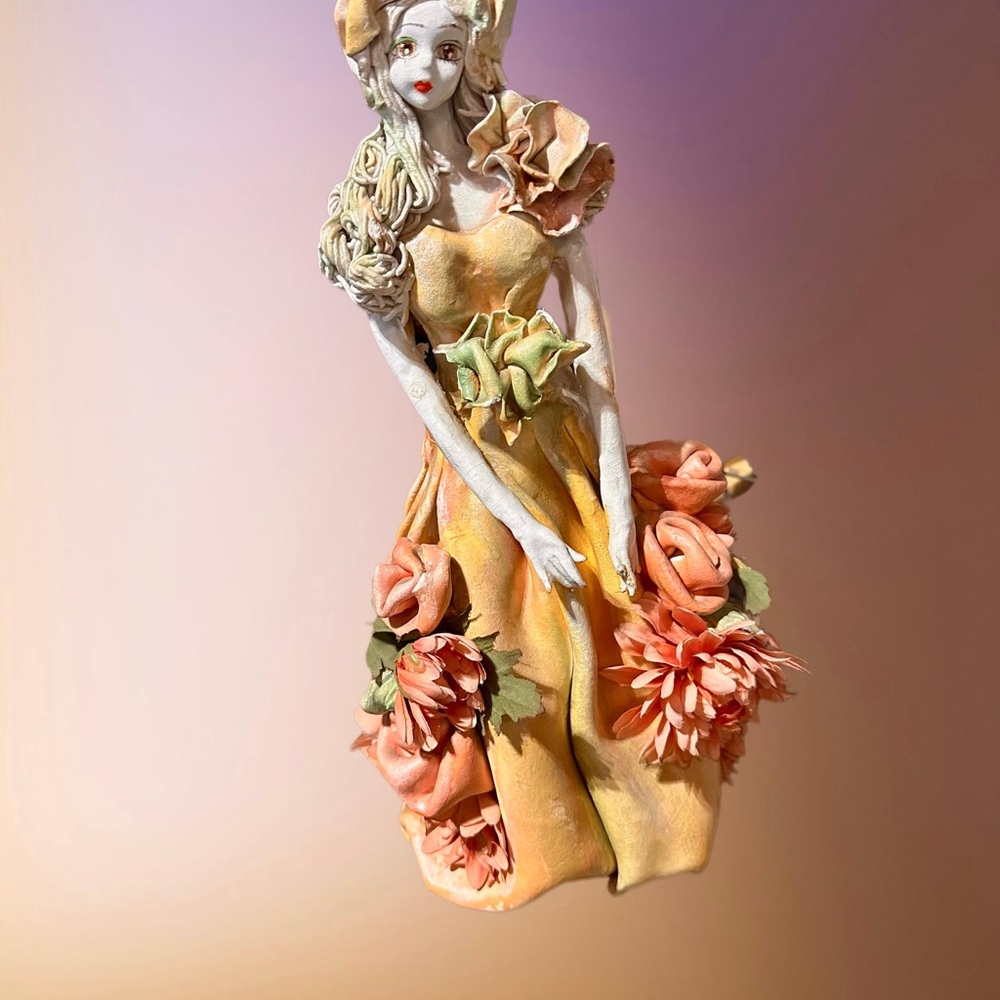 Floral Figurine with Orange and Green Accents